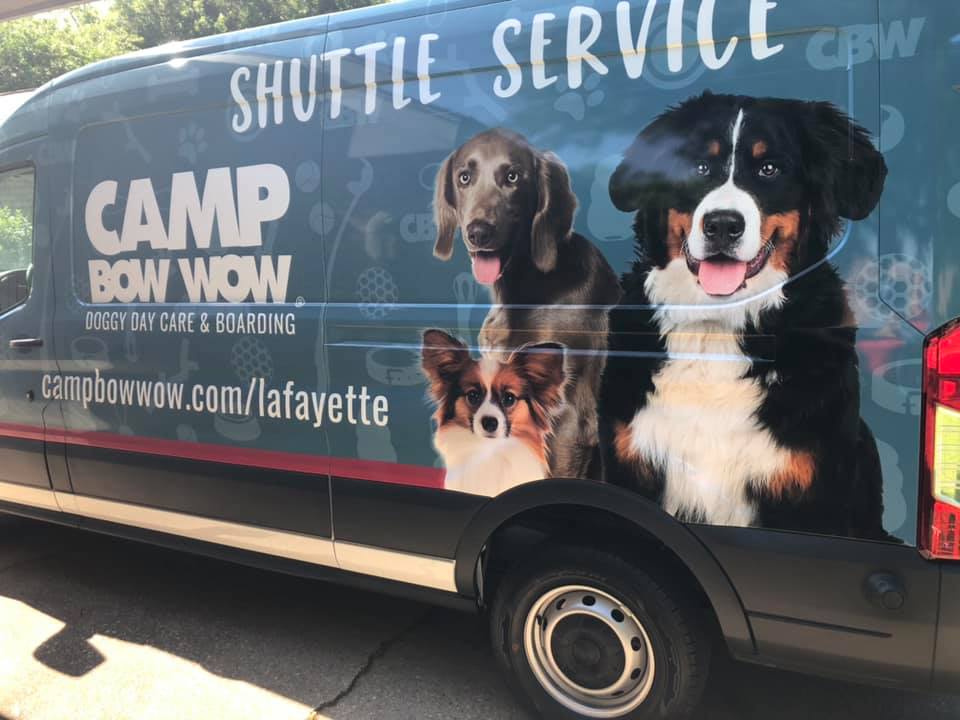 exterior of Camp Bow Wow shuttle van